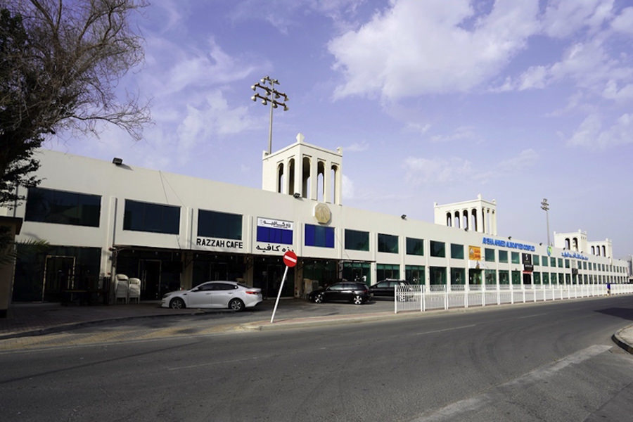 Exterior facade of a modern retail and commercial complex built by Almoayyed Contracting Group.