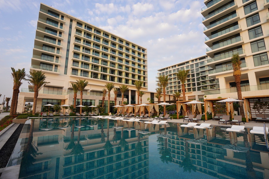 Luxury hotel resort featuring a large swimming pool and modern architecture by Almoayyed Contracting Group.