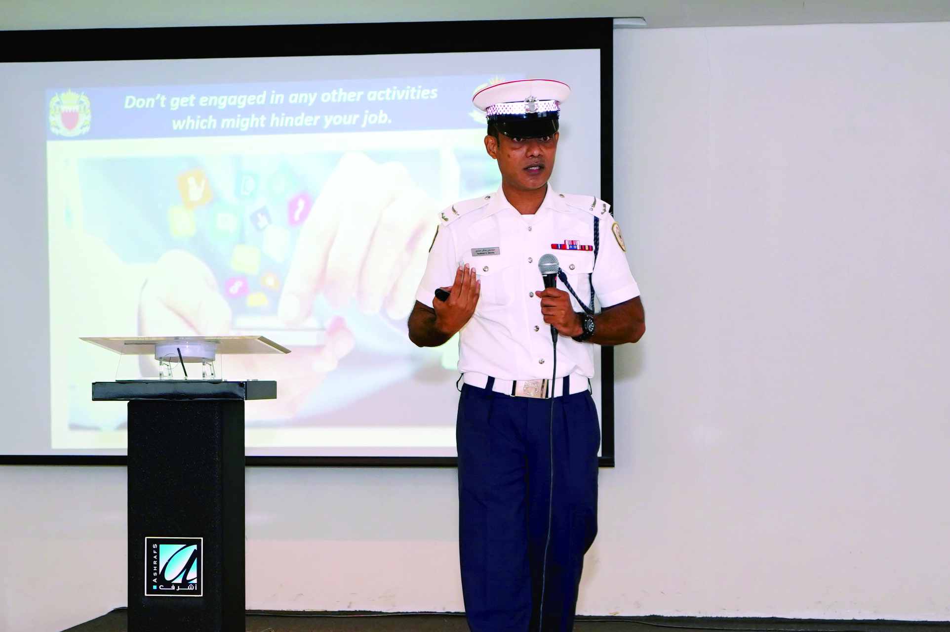 Presenter conducting a business strategy session for Almoayyed Contracting Group team members.